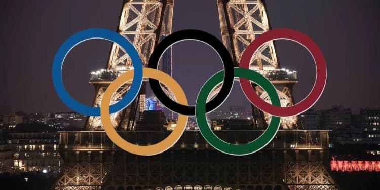 Les Anneaux Olympiques Illuminent la Tour Eiffel pour Paris 2024 - Viral Mag À moins de 50 jours des Jeux Olympiques de Paris les emblématiques anneaux olympiques ont été installés sur la Dame de Fer offrant un spectacle grandiose Viral Mag